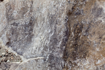 Gray-beige stone texture. Rock. Stone background. Relief surface. Beautiful natural pattern on the plane. Raster image