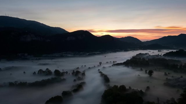 Timelapse of the fog at Adda river valley in the morning ,italy
