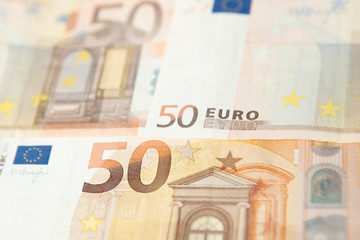 Closeup of a group of fifty euros banknote background
