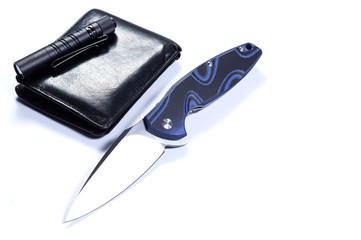Pocket knife and men's wallet. Male style.