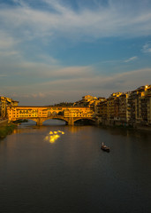 Fototapeta premium A view of Ponte Vecchio bridge on sunset time