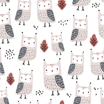 Seamless pattern with owls and leaves. Creative woodland childish texture in autumn colors. Great for fabric, textile Vector Illustration