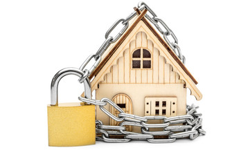 Model of house locked by padlock with chain. Isolated on white.