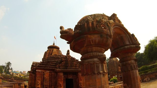 ancient temple Rajarani and arch with bas-reliefs red flag on roof Bhubaneswar Orissa