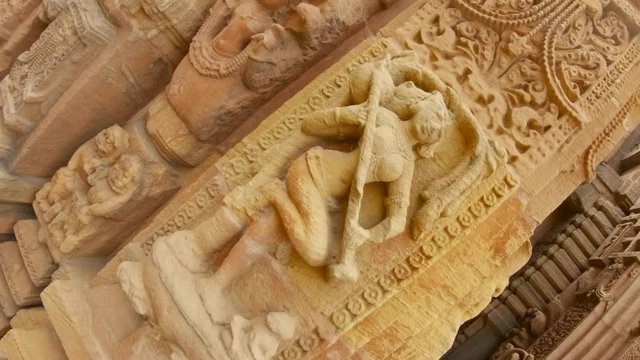 apsara female spirit with veena Indian musician instrument bas-relief on wall of ancient hindu temple Rajarani Bhubaneswar Orissa