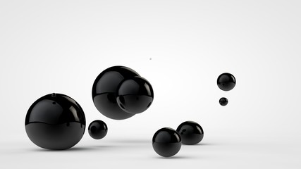 3D image of black balls in space. Balls of different sizes isolated on white background. Abstract, futuristic image of contrast of black and white. 3D rendering, illustration.
