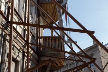 metal beams to strengthen the facade against the collapse of the old building in the historic center of Tbilisi in Georgia