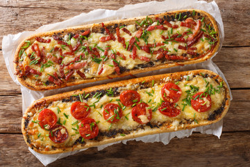 Delicious casserole sandwich with bacon, mushrooms, tomatoes and mozzarella cheese close-up....