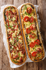 Delicious casserole sandwich with bacon, mushrooms, tomatoes and mozzarella cheese close-up. Vertical view top - obrazy, fototapety, plakaty