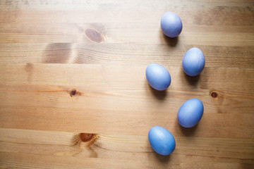 painted purple eggs wooden Easter background