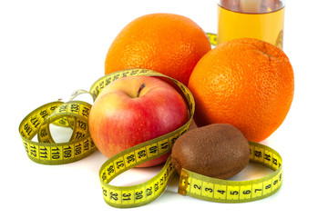 Apple, orange, kiwi with measure tape on white background