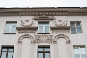 Random building in Minsk, Belarus with communism symbols of Soviet era