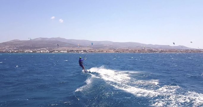 Kite Surfers gathering at Antiparos island for amazing sport event, pan shot