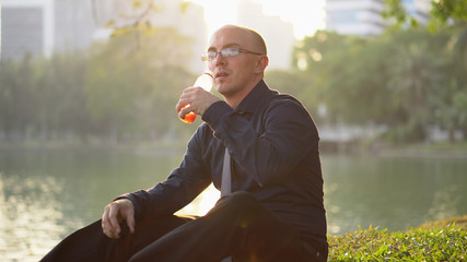 Healthy Lifestyle - Confident Man Drinking Healthy Smoothie in Park
