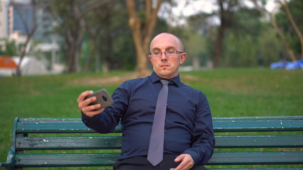 Fototapeta premium Forced Happiness - Depressed Sad Man Fake Smiling For Social Media Selfie