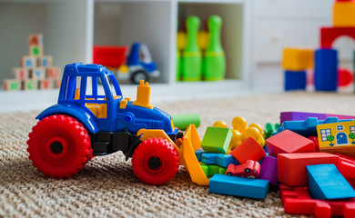 Children's playroom with plastic colorful educational blocks toys.