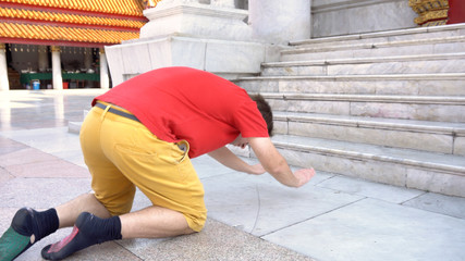 Caucasian Ex Christian Man Converted To Buddhism Praying Devotedly At Buddhist Temple