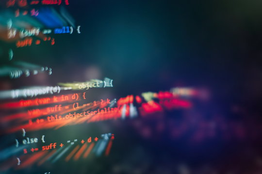 HTML5 in editor for website development. Website HTML Code on the Laptop Display Closeup Photo.