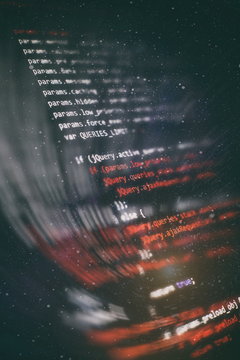 HTML5 in editor for website development. Website HTML Code on the Laptop Display Closeup Photo.