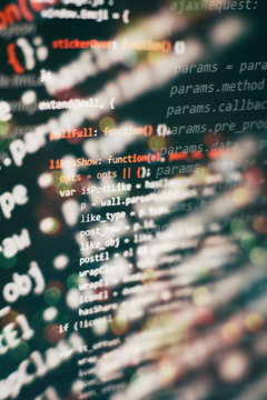 HTML5 in editor for website development. Website HTML Code on the Laptop Display Closeup Photo.