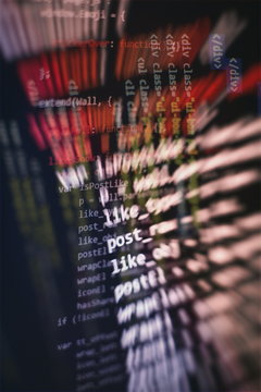 HTML5 in editor for website development. Website HTML Code on the Laptop Display Closeup Photo.