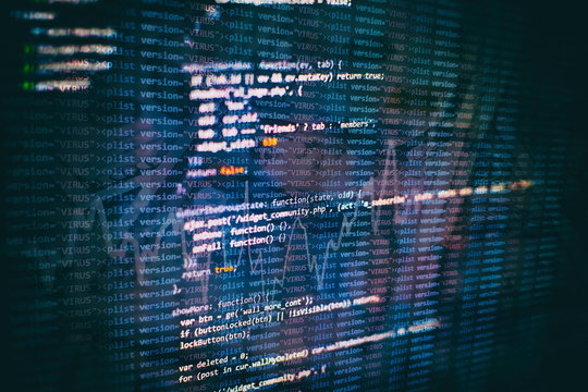 CSS, JavaScript and HTML usage. Monitor closeup of function source code. Abstract IT technology background. Software source code.