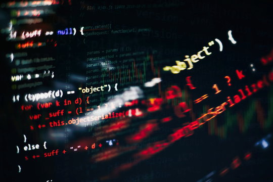 CSS, JavaScript and HTML usage. Monitor closeup of function source code. Abstract IT technology background. Software source code.