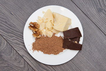 Handmade carob chocolate with nuts. Ingredients cocoa butter, carob. Top view.