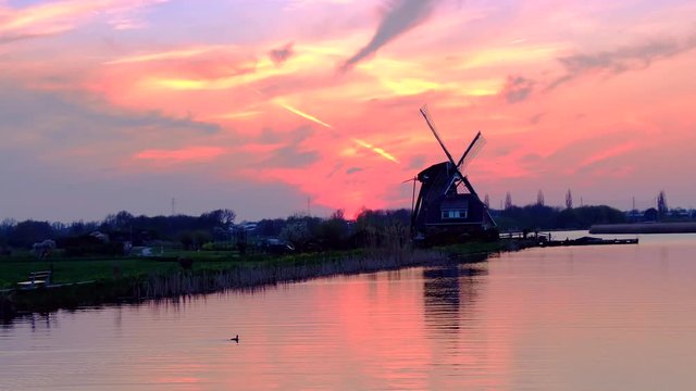 Historic dutch windmill at sunset in Leiden, Holland