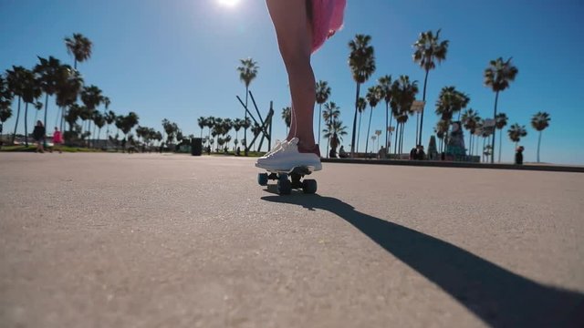 Skateboard with its wheels spinning. Slow motion 4k