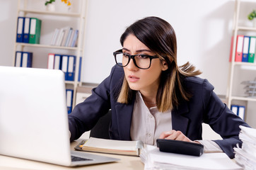 Young female employee working in the office 