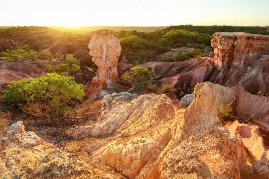 Setting sun shines over Marafa depression Hell's Kitchen geological formation near Watamu, Kenya