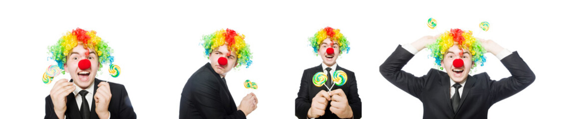 Clown with lollipop isolated on white