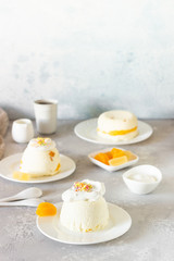 Cottage cheese dessert with apricot filling decorated with whipped cream. 