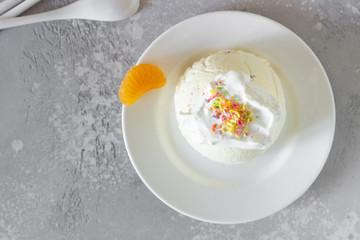 Cottage cheese dessert with apricot filling decorated with whipped cream. 