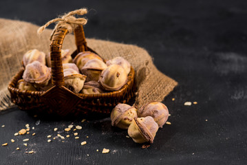 Sweet tasty pastry filling with cream on the black background