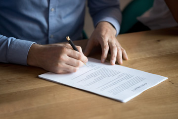 Business man customer hand sign contract, close up view