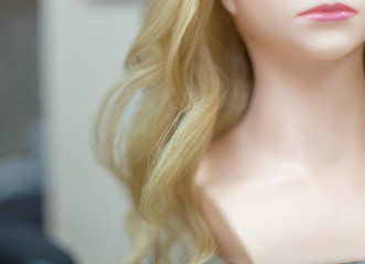 Training hairstyles on a mannequin