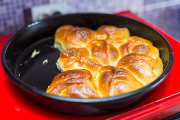 Hot samsa with lamb on the surface of the electric stove