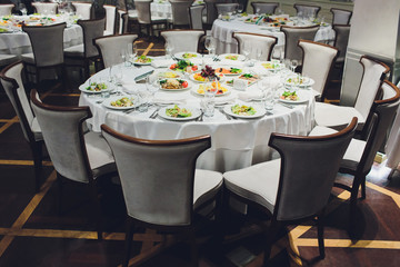 Luxury, elegant wedding reception table arrangement, floral centerpiece.