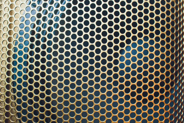 Musical powerful speaker with a protective grill close-up.