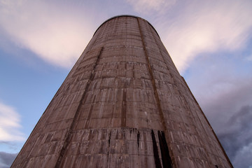 Fototapeta na wymiar low angle view of a chimney wall of concrete against sky