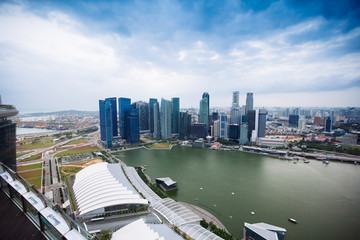 Fototapeta na wymiar SINGAPORE - JANUARY 20, 2014: Urban landscape of Singapore. Skyline and modern skyscrapers of business district Marina Bay