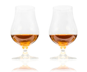 Two glasses of premium alcohol (rum, cognac, whiskey) isolated on white background