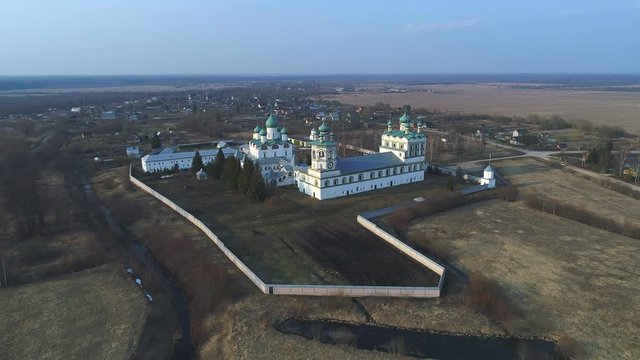 View of the Nikolo-Vyazhischskiy Monastery, Sunny April evening (aerial video). Novgorod region, Russia 
