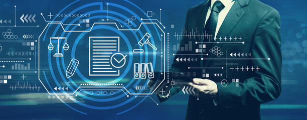 Compliance theme with businessman holding a tablet computer