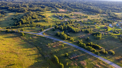 Top view of the road through the agricultural field