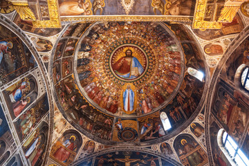 Fototapeta na wymiar The dome of the baptistery with frescoes 14th century representing of Christ, the saints and angels. Padua, Italy