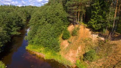 High sandy bank of the Polomet River, Novgorod Region, Russia