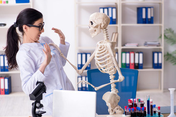 Young female archaeologist working in the lab 